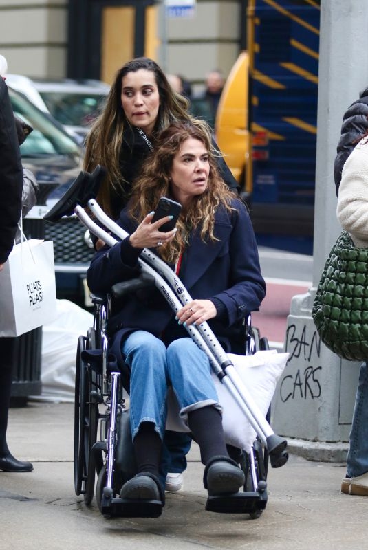 LUCIANA GIMENEZ in a Wheelchair with Crutches Out in New York 01/28/2023