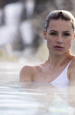 MICHELLE HUNZIKER in Bikini at a Pool in San Cassiano, December 2022