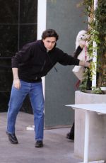 NICOLA PELTZ and Brooklyn Beckham Out for Lunch with Their Dog at Sweetgreen Health Food Restaurant in Beverly Hills 01/24/2023
