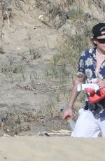 NICOLA PELTZ and SELENA GOMEZ at a Beach in Cabo San Lucas 01/02/2023