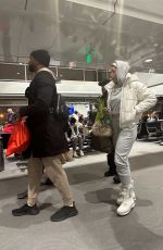 NICOLE MURPHY Out with a Mystery Man at Aspen Airport 01/04/2023