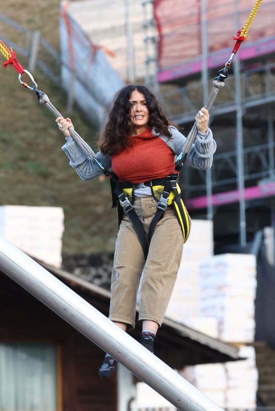 SALMA HAYEK on a Bungee Trampoline in Gstaad 01/01/2023