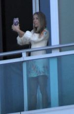 TISH CYRUS and Dominic Purcell  on Their Balcony in Miami 12/31/2022