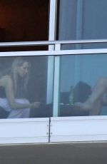 TISH CYRUS and Dominic Purcell  on Their Balcony in Miami 12/31/2022