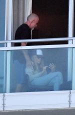 TISH CYRUS and Dominic Purcell  on Their Balcony in Miami 12/31/2022