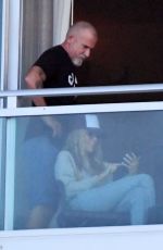 TISH CYRUS and Dominic Purcell  on Their Balcony in Miami 12/31/2022
