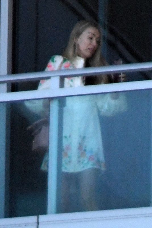 TISH CYRUS and Dominic Purcell  on Their Balcony in Miami 12/31/2022
