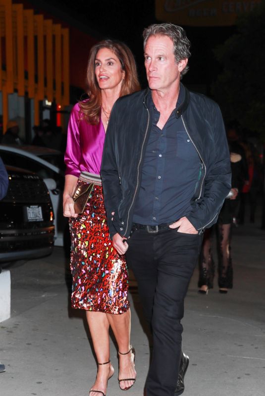 CINDY CRAWFORD and Rande Gerber Arrives at Catch Steak in West Hollywood 02/04/2023