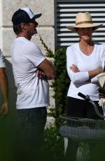 CINDY CRAWFORD and Rande Gerber at a Pool in Miami Beach 02/16/2023