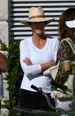 CINDY CRAWFORD and Rande Gerber at a Pool in Miami Beach 02/16/2023