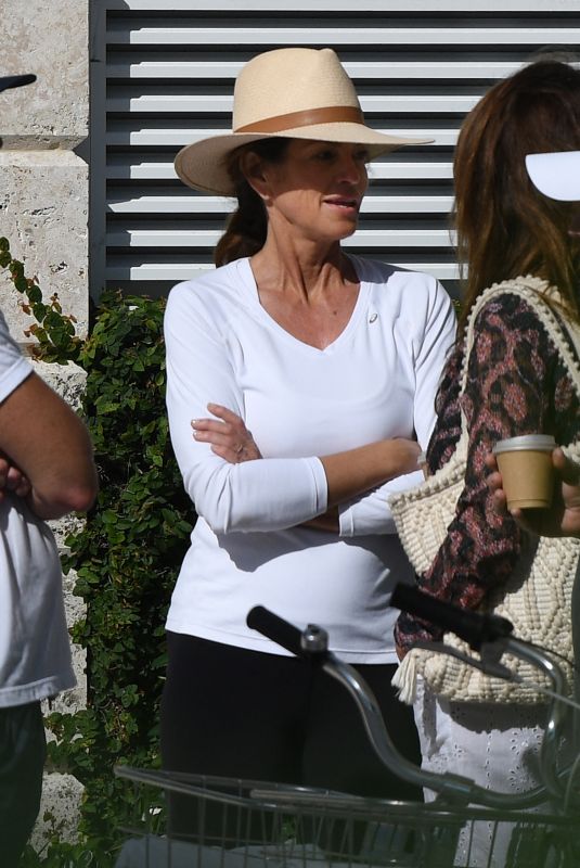 CINDY CRAWFORD and Rande Gerber at a Pool in Miami Beach 02/16/2023