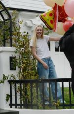 DAKOTA FANNING Receives Loads of Balloons for Her 29th birthday in Los Angeles 02/23/2023