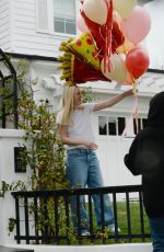 DAKOTA FANNING Receives Loads of Balloons for Her 29th birthday in Los Angeles 02/23/2023