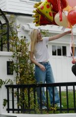 DAKOTA FANNING Receives Loads of Balloons for Her 29th birthday in Los Angeles 02/23/2023