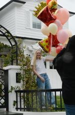 DAKOTA FANNING Receives Loads of Balloons for Her 29th birthday in Los Angeles 02/23/2023