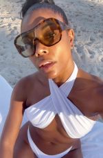 GABRIELLE UNION in a White Bikini at a Beach 12/04/2022