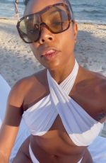 GABRIELLE UNION in a White Bikini at a Beach 12/04/2022
