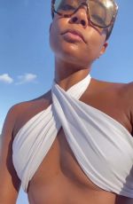 GABRIELLE UNION in a White Bikini at a Beach 12/04/2022