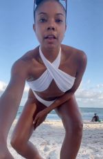 GABRIELLE UNION in a White Bikini at a Beach 12/04/2022