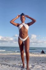 GABRIELLE UNION in a White Bikini at a Beach 12/04/2022