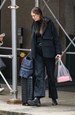 KARLIE KLOSS Goes Makeup Free Carrying Her Luggage in New York 02/06/2023
