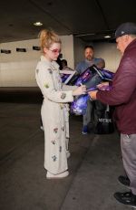 KATHRYN NEWTON Signs for Fans in Her Pajamas at LAX in Los Angeles 02/17/2023