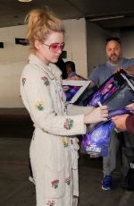 KATHRYN NEWTON Signs for Fans in Her Pajamas at LAX in Los Angeles 02/17/2023