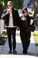 KOURTNEY KARDASHIAN and Travis Barker Out in West Hollywood 02/20/2023