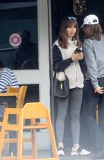 LILY COLLINS and Oliver Cooper Out for Lunch with Friends in Beverly Hills 02/18/2023