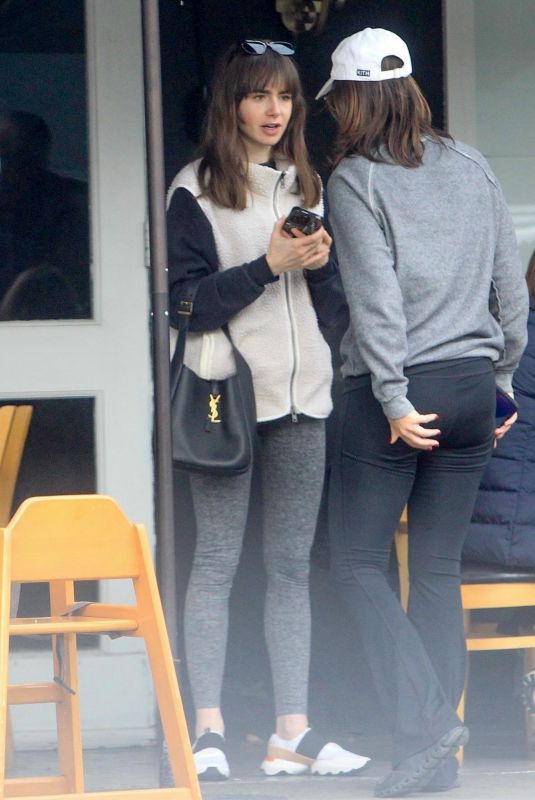 LILY COLLINS and Oliver Cooper Out for Lunch with Friends in Beverly Hills 02/18/2023