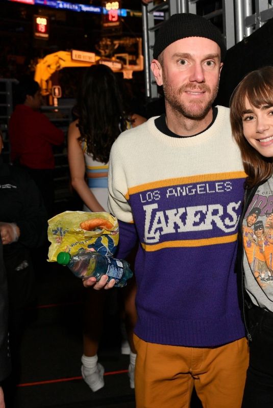 LILY COLLINS at a Lakers Game in Los Angeles 02/23/2023