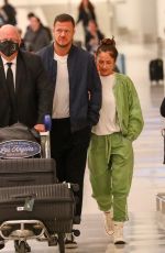 MINKA KELLY and Dan Reynolds at LAX Airport in Los Angeles 02/18/2023