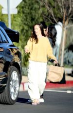 MINKA KELLY Picking Up Her Dog from a Friend