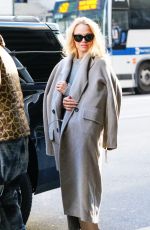 PAMELA ANDERSON Leaves Her Hotel with in New York 02/03/2022