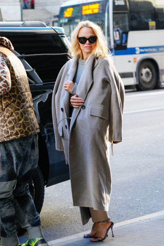 PAMELA ANDERSON Leaves Her Hotel with in New York 02/03/2022