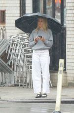 SIENNA MILLER Out on a Rainy Day in New York 02/16/2023