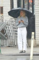 SIENNA MILLER Out on a Rainy Day in New York 02/16/2023