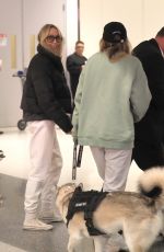 TISH and BRANDY CYRUS with Their Service Dog Arrives in Los Angeles 02/03/2023