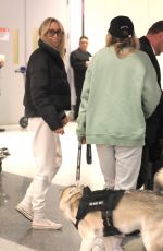TISH and BRANDY CYRUS with Their Service Dog Arrives in Los Angeles 02/03/2023