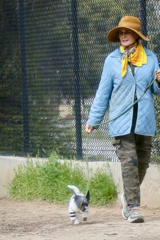 ANDIE MACDOWELL Out with Her Dog at Silverlake Reservoir Walking Trails 03/05/2023