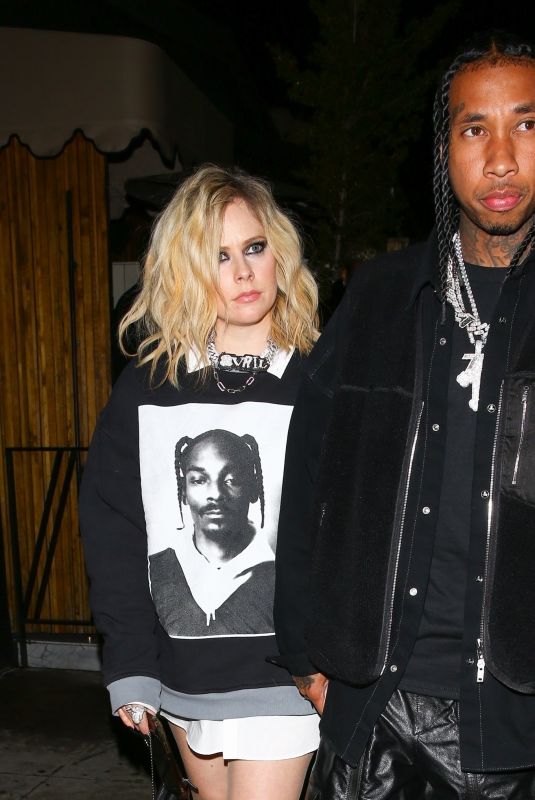 AVRIL LAVIGNE and Tyga Leaves Kyrie Irving’s Birthday Party in West Hollywood 03/23/2023