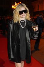 AVRIL LAVIGNE Arrives at Christian Louboutin Show at Paris Fashion Week 03/02/2023