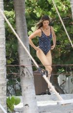 GISELE BUNDCHEN in Swimsuit at a Beach in Miami 03/23/2023