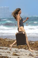 GISELE BUNDCHEN in Swimsuit at a Beach in Miami 03/23/2023