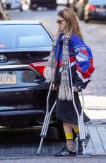 NATALIA DYER Walks with the Help of Crutches Out in New York 03/20/2023