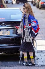 NATALIA DYER Walks with the Help of Crutches Out in New York 03/20/2023