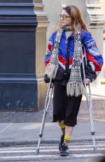 NATALIA DYER Walks with the Help of Crutches Out in New York 03/20/2023
