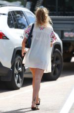 RITA and ELENA ORA Out for Lunch with Their Parents Ora at Bondi Icebergs in Sydney 03/30/2023