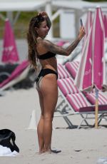 SOPHIA THOMALLA in a Black Bikini at a Beach in Miami 03/21/2023