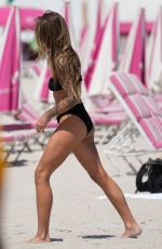 SOPHIA THOMALLA in a Black Bikini at a Beach in Miami 03/21/2023